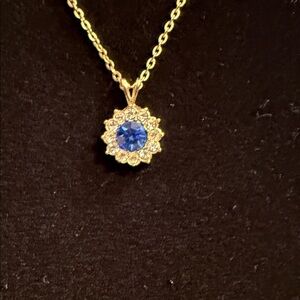 Gold Flower Pendant Necklace with Blue Center Stone